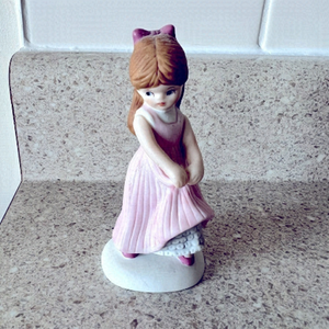 Vintage enesco girl in a pink dress